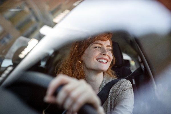 woman test driving a car image